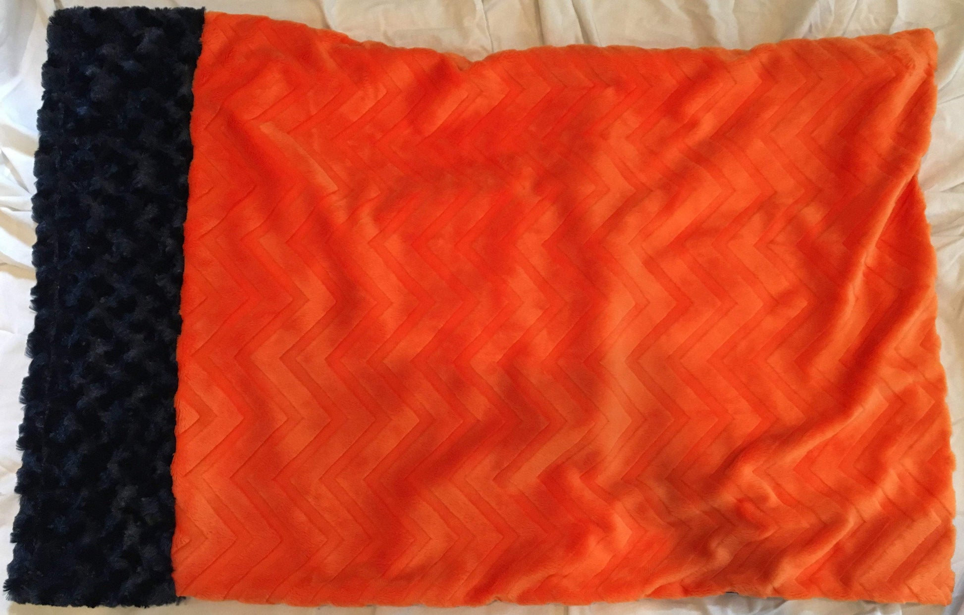 Zig Zag Zebra Print Pillowcase with Navy Rosette Trim and Embossed Orange Chevron Back