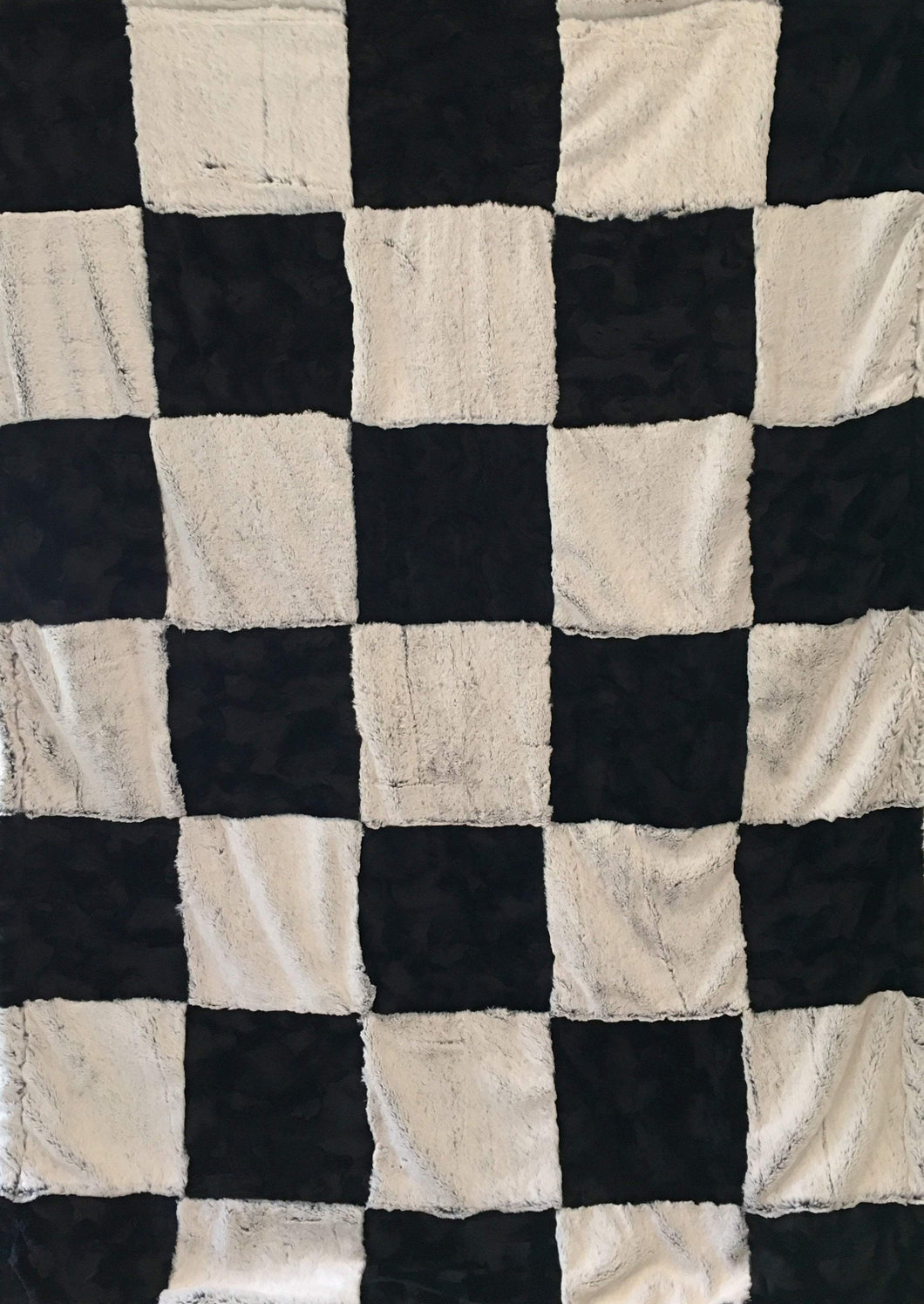 Luxe Cuddle Black Frost and Luxe Cuddle Caviar Hide Patchwork Throw on Luxe Cuddle Black Frost